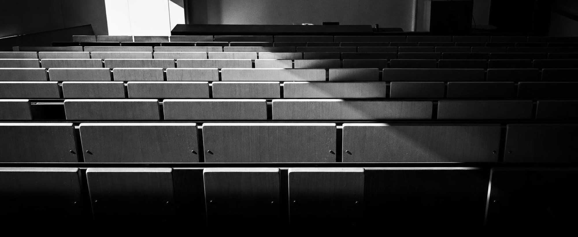 Empty tiered seating in a lecture theatre