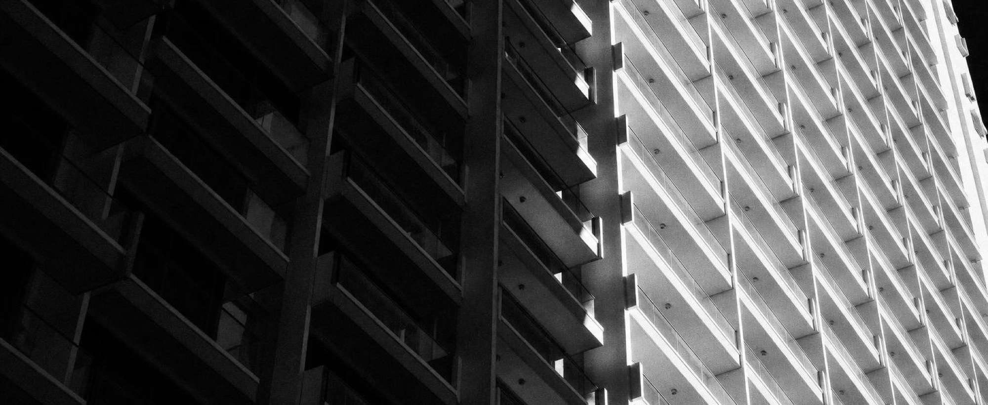 Apartment balconies stacked up a tower façade